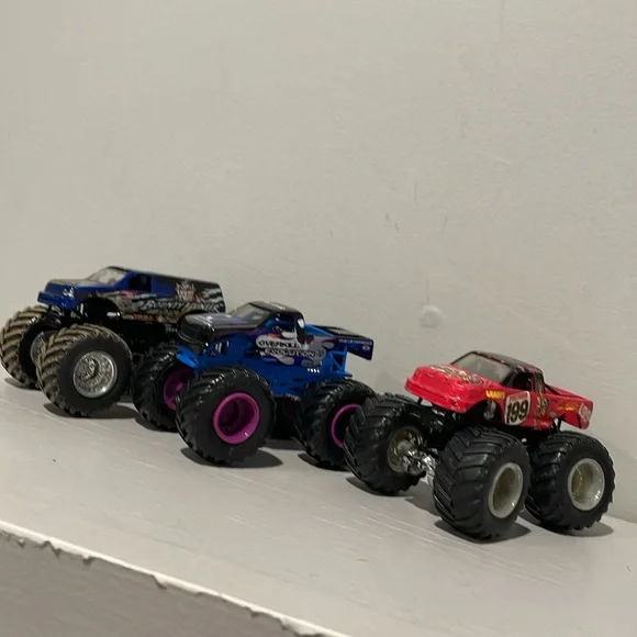 Monster Jam Trucks 1:64 Bounty Hunter, Overall Evolution and HotWheels 199 - Picture 2 of 4